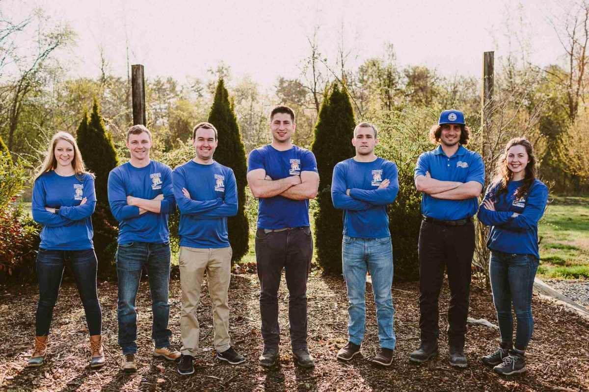 Crew member carrying boxes